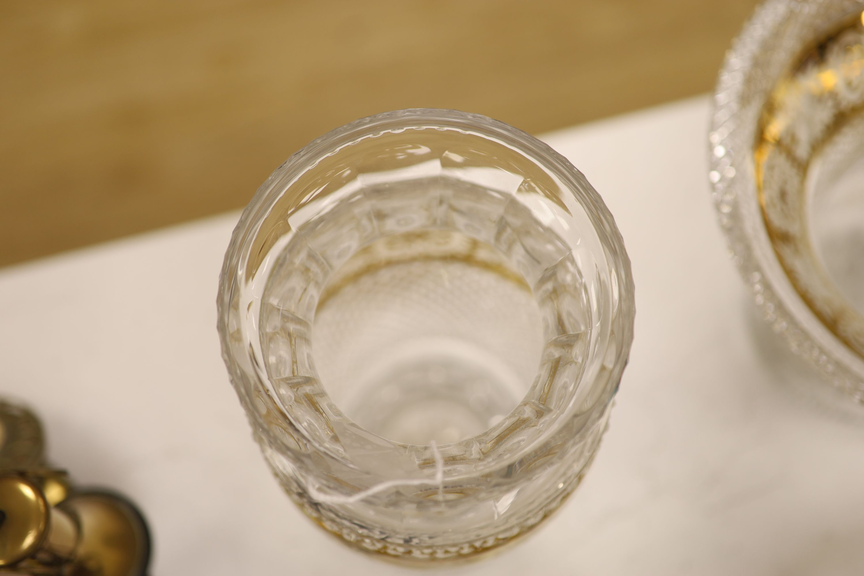 A Moser style tall tapered cut glass vase heightened in gilt, a similar circular bowl, a pedestal bowl and two St Louis tumblers